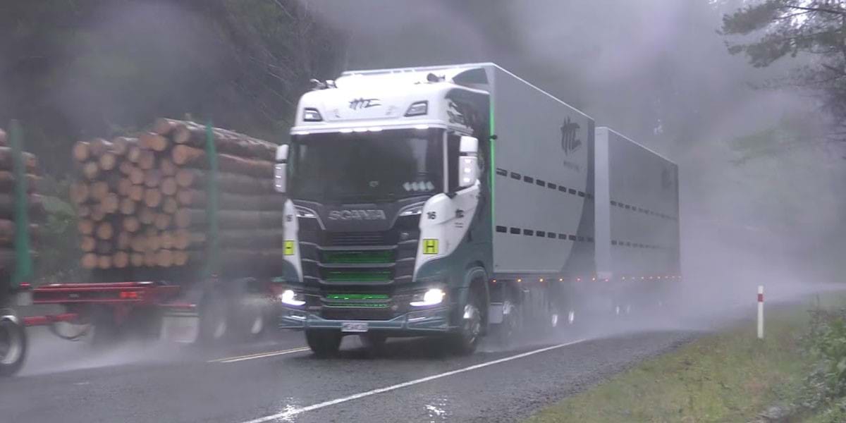 Truck driving through wet road
